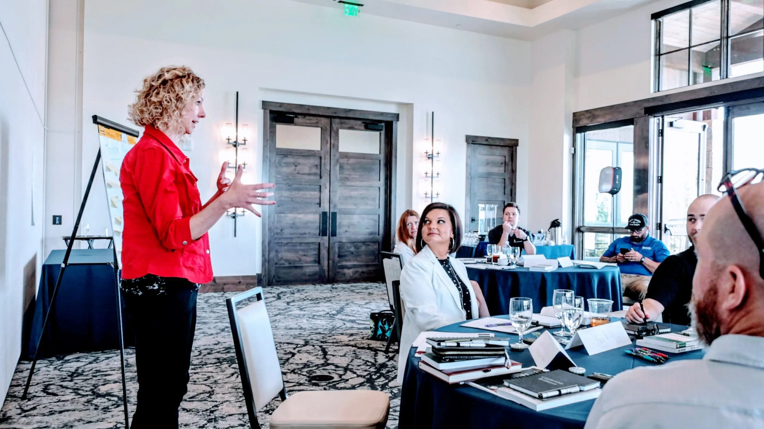 Professional women engaging in discussion at conference