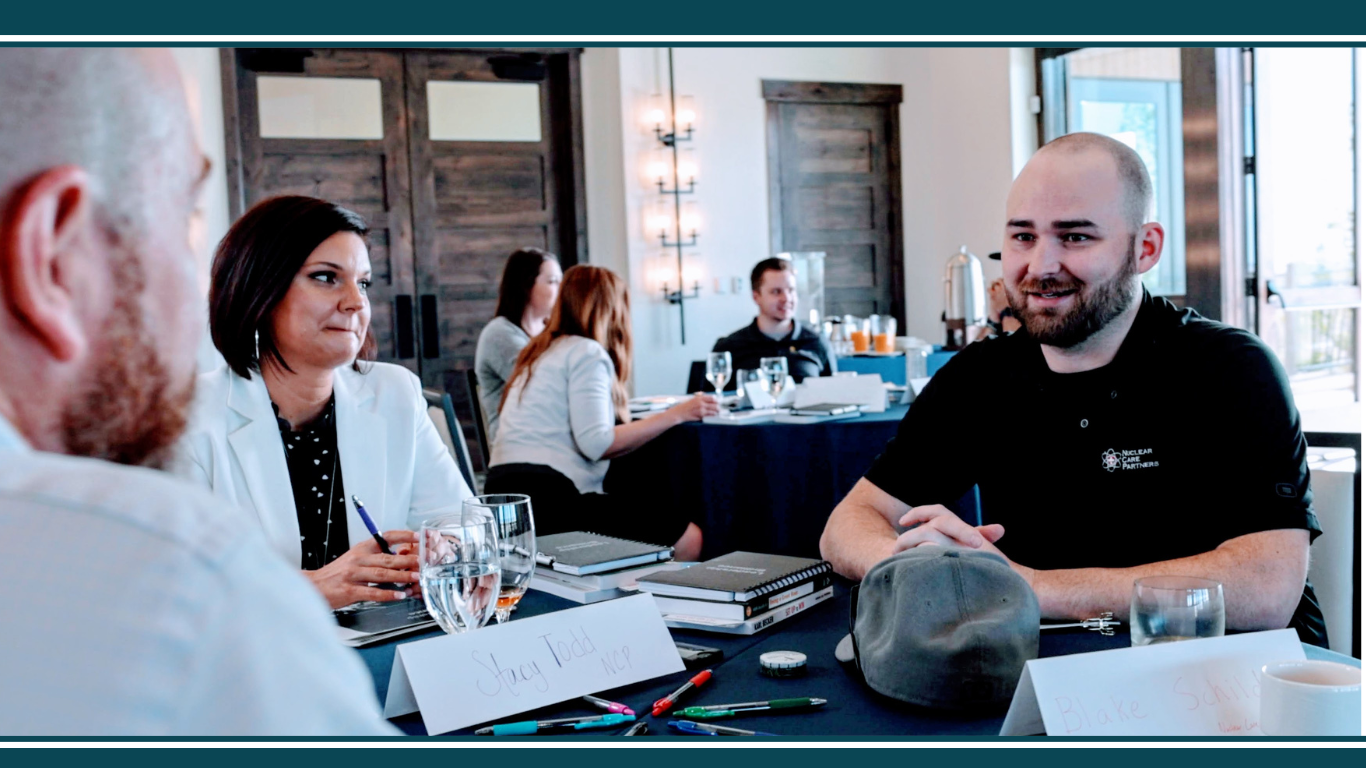 Business coach engaging with attendees